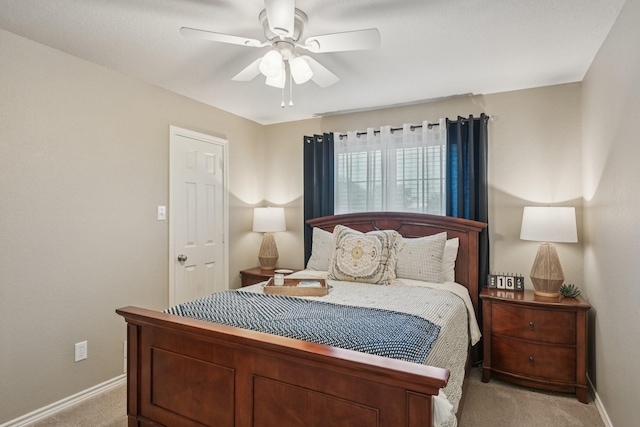 3707 Elizabeth Dr, Carrollton, TX 75007 - carpeted bedroom with baseboards and a ceiling fan