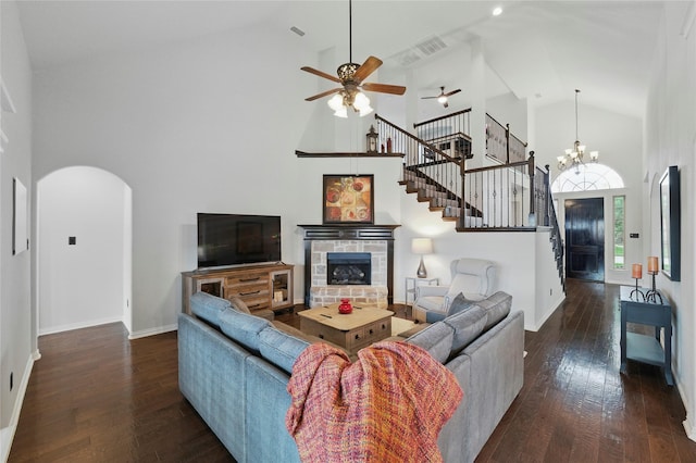 5413 Percy Priest St, Fort Worth, TX 76179 - living area with high vaulted ceiling, a ceiling fan, arched walkways, dark wood finished floors, and stairs