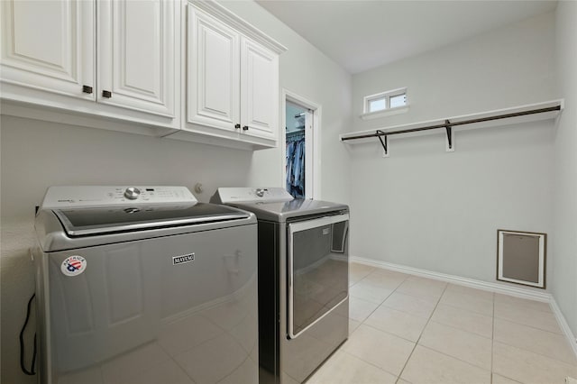 5413 Percy Priest St, Fort Worth, TX 76179 - laundry area featuring cabinet space, washer and dryer, and light tile patterned flooring