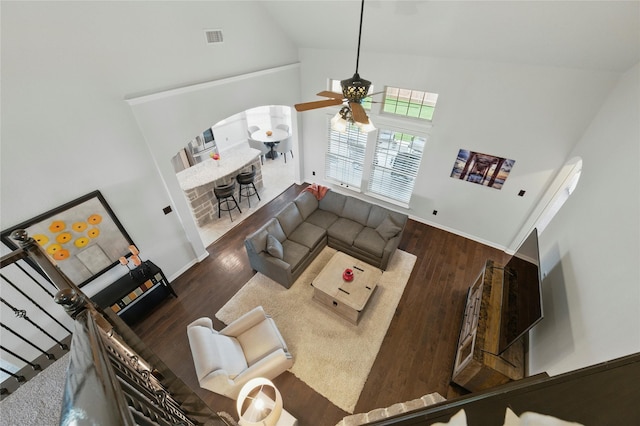 5413 Percy Priest St, Fort Worth, TX 76179 - living room with high vaulted ceiling, a ceiling fan, wood finished floors, and arched walkways