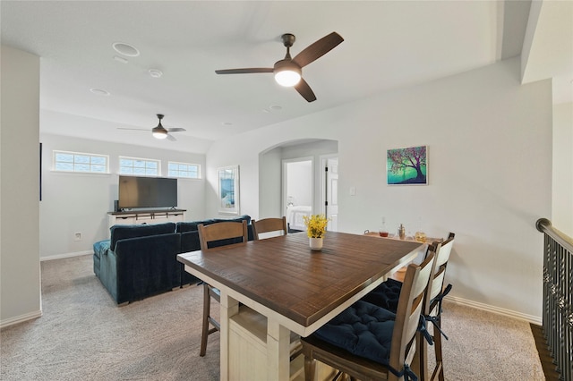 5413 Percy Priest St, Fort Worth, TX 76179 - dining room featuring a ceiling fan, light colored carpet, and arched walkways