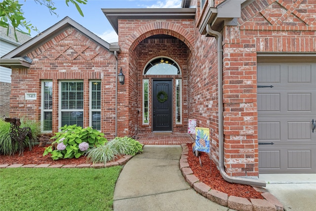 5413 Percy Priest St, Fort Worth, TX 76179 - property entrance featuring an attached garage and brick siding
