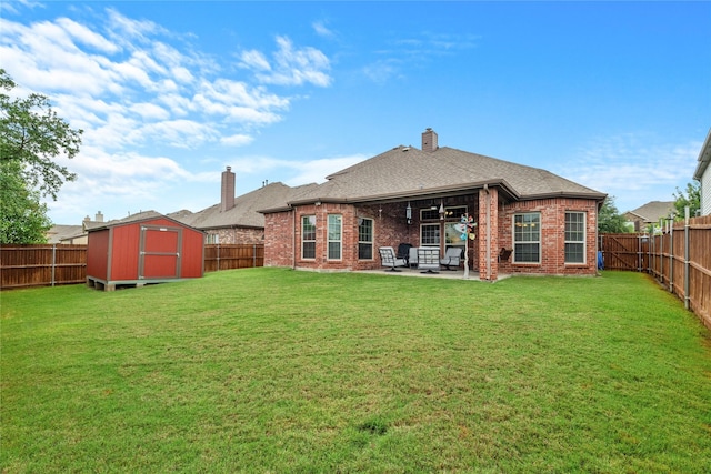 5413 Percy Priest St, Fort Worth, TX 76179 - rear view of property with a patio area, a storage unit, a chimney, and a fenced backyard