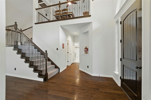 5413 Percy Priest St, Fort Worth, TX 76179 - foyer featuring hardwood / wood-style flooring, a high ceiling, stairway, and a chandelier