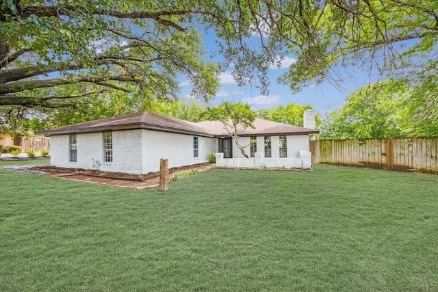 4132 Alava Dr, Fort Worth, TX 76133 - rear view of property with a chimney, a fenced backyard, and brick siding