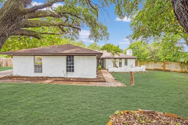 4132 Alava Dr, Fort Worth, TX 76133 - rear view of property with a chimney, a fenced backyard, and brick siding