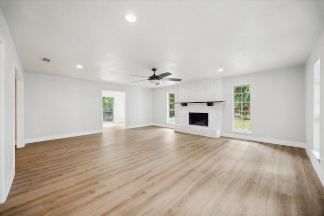 4132 Alava Dr, Fort Worth, TX 76133 - unfurnished living room featuring a fireplace, ceiling fan, light wood finished floors, and recessed lighting