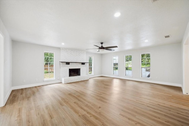 4132 Alava Dr, Fort Worth, TX 76133 - unfurnished living room featuring light wood finished floors, ceiling fan, a fireplace, and recessed lighting