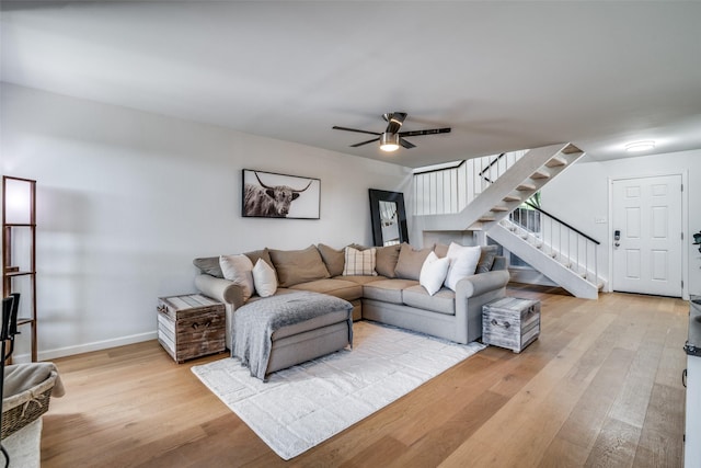 9707 Highland View Dr, Dallas, TX 75238 - living area featuring light wood-style flooring, stairs, and a ceiling fan