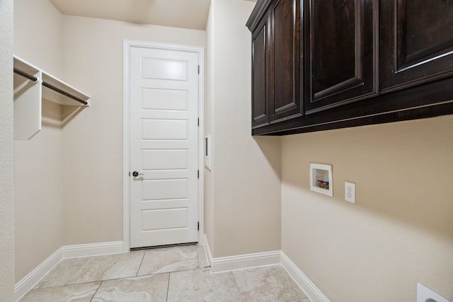 1256 Teton Dr, Burleson, TX 76028 - laundry room with cabinet space, washer hookup, and light tile patterned floors