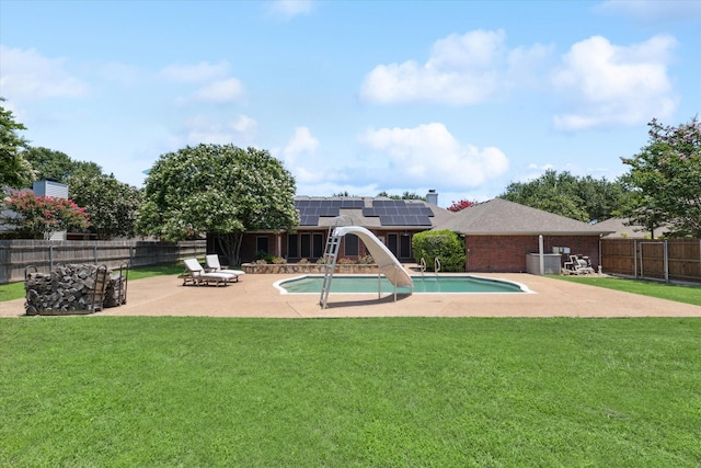 1005 Prairie Ln, Mcgregor, TX 76657 - view of swimming pool with a water slide, a patio area, and a fenced backyard