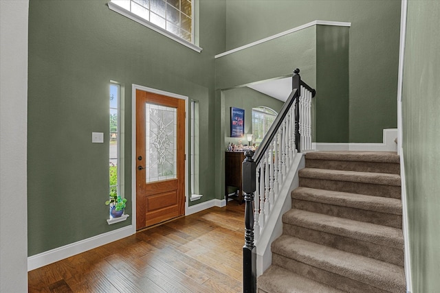 1045 Hillcrest Cir, Rockwall, TX 75087 - entryway with hardwood / wood-style floors, stairs, and a high ceiling