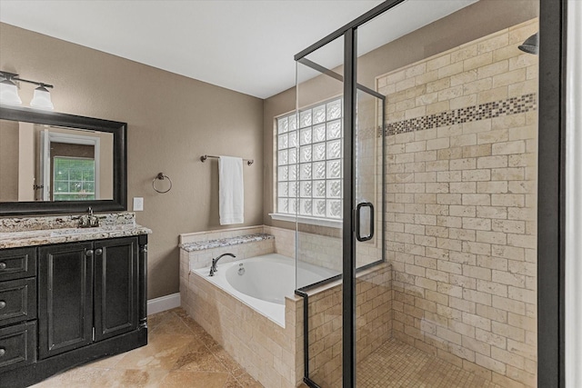 1045 Hillcrest Cir, Rockwall, TX 75087 - bathroom with a bath, vanity, a shower stall, and tile patterned floors