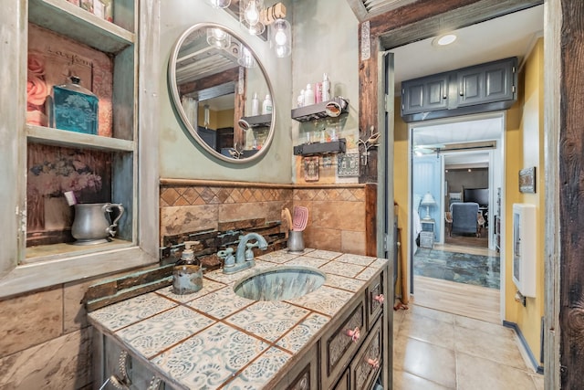 2057 Breezywood Dr, Flower Mound, TX 75022 - bathroom featuring vanity, tile patterned flooring, and tile walls