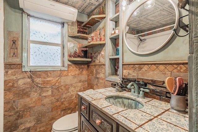 2057 Breezywood Dr, Flower Mound, TX 75022 - bathroom with tile walls, vanity, an AC wall unit, and a wainscoted wall