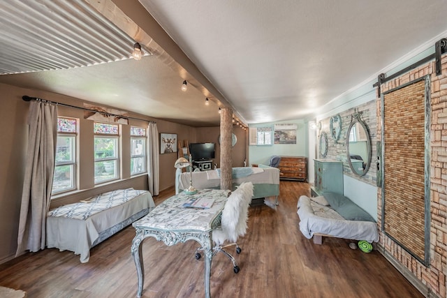 2057 Breezywood Dr, Flower Mound, TX 75022 - bedroom with wood finished floors and brick wall