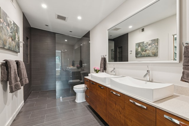 10832 Cinderella Ln, Dallas, TX 75229 - full bath with double vanity, recessed lighting, and a walk in shower
