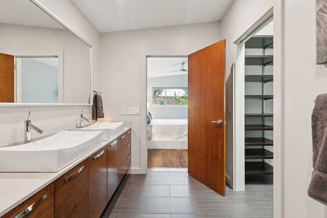 10832 Cinderella Ln, Dallas, TX 75229 - full bathroom with connected bathroom, double vanity, and a ceiling fan