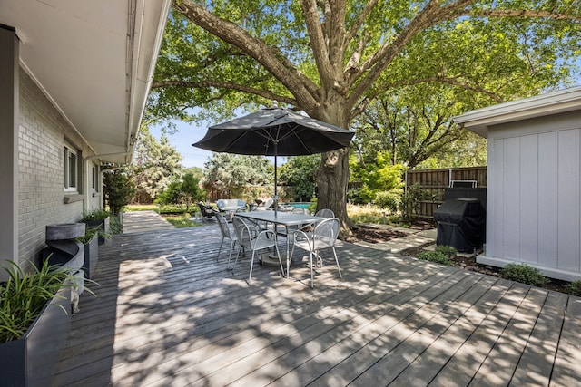 10832 Cinderella Ln, Dallas, TX 75229 - wooden deck with outdoor dining space and a grill