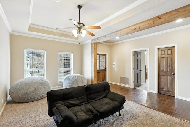 12780 Cartwright Trl, Ponder, TX 76259 - living room featuring crown molding, a ceiling fan, dark wood-style floors, and a tray ceiling