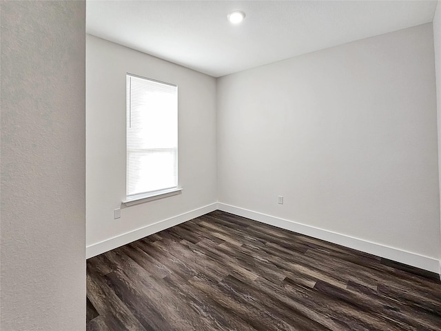 140 Mohican Trl, Mabank, TX 75156 - empty room with dark wood-type flooring and baseboards