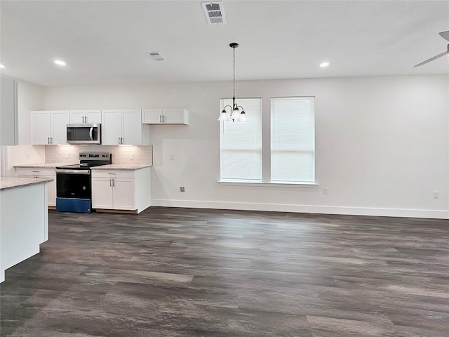 140 Mohican Trl, Mabank, TX 75156 - kitchen with stainless steel appliances, white cabinetry, pendant lighting, tasteful backsplash, and recessed lighting