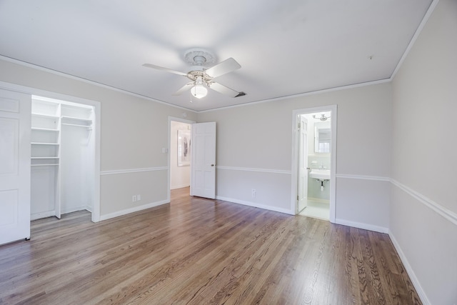 6420 Waverly Way, Fort Worth, TX 76116 - unfurnished bedroom featuring light wood-style flooring, a closet, a ceiling fan, connected bathroom, and crown molding