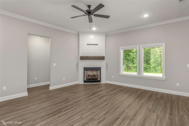 1013 Voss Dr, Stonewall, LA 71078 - unfurnished living room featuring ornamental molding, wood finished floors, a large fireplace, a ceiling fan, and recessed lighting