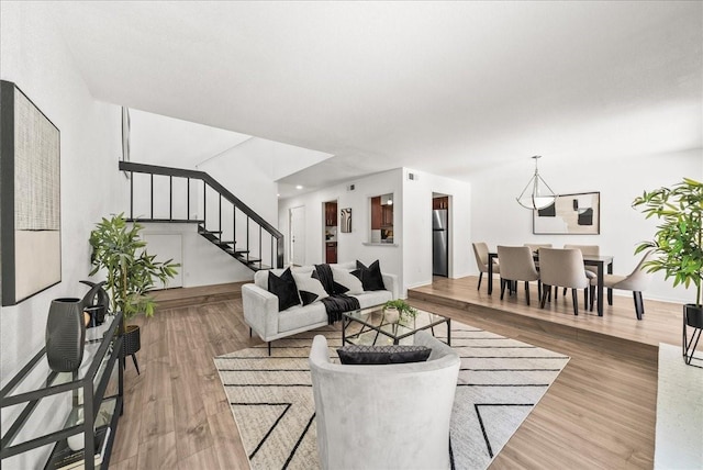 9206 Flickering Shadow Dr, Dallas, TX 75243 - living area featuring stairway and wood finished floors