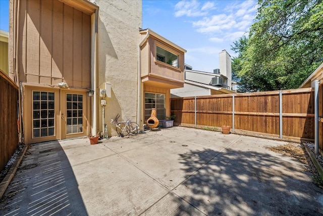9206 Flickering Shadow Dr, Dallas, TX 75243 - fenced backyard with a patio area and french doors