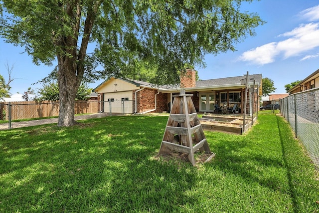 4201 Blackwillow Dr, Mesquite, TX 75150 - rear view of house with brick siding, a chimney, and a garage