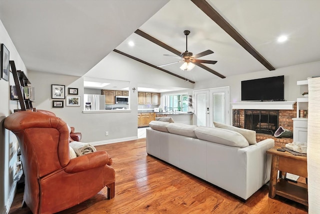 4201 Blackwillow Dr, Mesquite, TX 75150 - living room with ceiling fan, a brick fireplace, light wood-type flooring, and recessed lighting