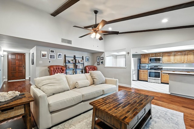 4201 Blackwillow Dr, Mesquite, TX 75150 - living room featuring beam ceiling, a ceiling fan, light wood-style floors, high vaulted ceiling, and recessed lighting