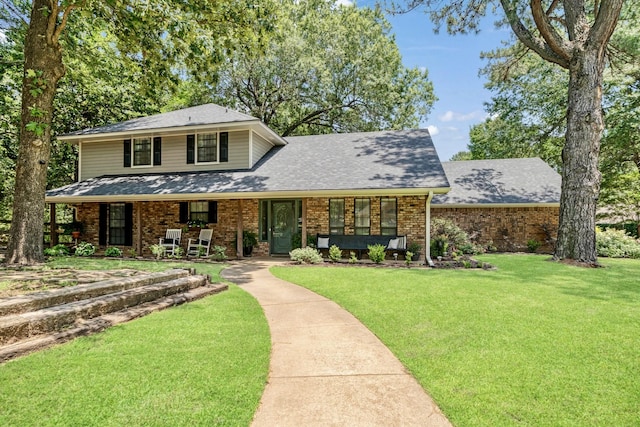 730 Cedar Crk, Reno, TX 75462 - view of front of home with brick siding, a front yard, covered porch, and a shingled roof