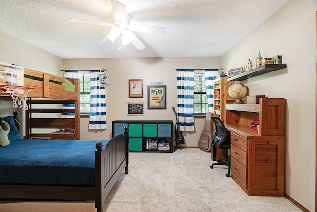 730 Cedar Crk, Reno, TX 75462 - bedroom featuring light colored carpet, a textured ceiling, a desk, and a ceiling fan