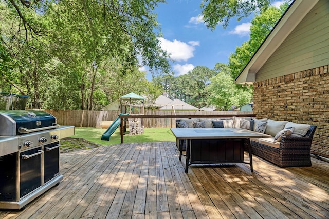 730 Cedar Crk, Reno, TX 75462 - wooden terrace with grilling area, a playground, a fenced backyard, and an outdoor living space
