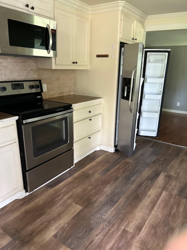 1330 Palmetto Rd, Benton, LA 71006 - kitchen with appliances with stainless steel finishes, dark wood-type flooring, backsplash, ornamental molding, and dark countertops