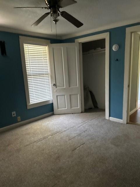 1330 Palmetto Rd, Benton, LA 71006 - unfurnished bedroom featuring carpet, a closet, and a ceiling fan