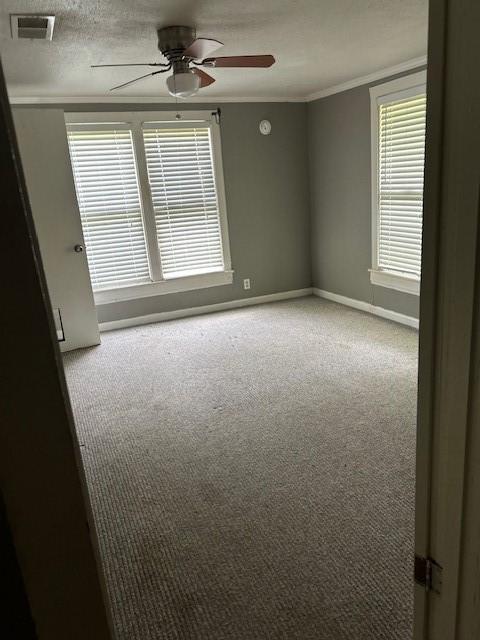 1330 Palmetto Rd, Benton, LA 71006 - carpeted empty room with ceiling fan and crown molding