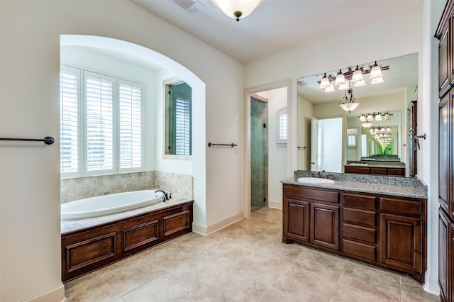 8540 Canyon Xing, Lantana, TX 76226 - full bathroom featuring a bath, a stall shower, vanity, and tile patterned flooring