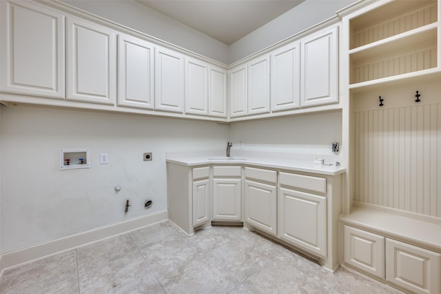 8540 Canyon Xing, Lantana, TX 76226 - laundry area with hookup for a gas dryer, electric dryer hookup, washer hookup, cabinet space, and light tile patterned floors