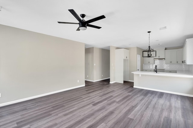 5136 Farnsworth Ave, Fort Worth, TX 76107 - unfurnished living room featuring wood finished floors and a ceiling fan