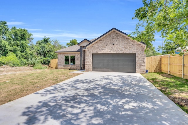 5136 Farnsworth Ave, Fort Worth, TX 76107 - view of front of house featuring brick siding, an attached garage, and concrete driveway