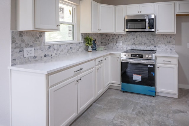 820 Vickie Dr, Azle, TX 76020 - kitchen featuring stainless steel appliances, white cabinets, light countertops, and tasteful backsplash