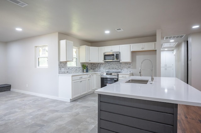 820 Vickie Dr, Azle, TX 76020 - kitchen with stainless steel appliances, decorative backsplash, white cabinetry, light countertops, and recessed lighting
