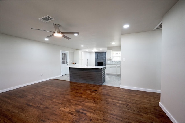 820 Vickie Dr, Azle, TX 76020 - unfurnished living room featuring a ceiling fan, wood finished floors, recessed lighting, and a brick fireplace