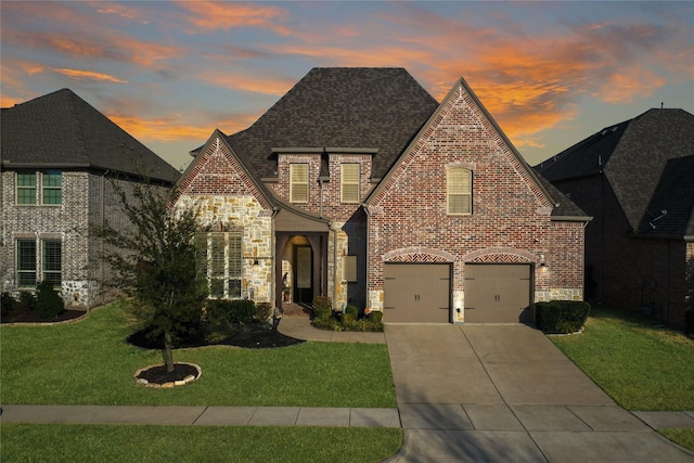 604 Rough Creek Dr, Mckinney, TX 75071 - view of front of property with stone siding, a front lawn, concrete driveway, and an attached garage
