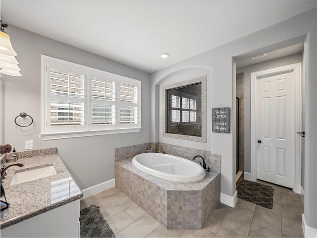 604 Rough Creek Dr, Mckinney, TX 75071 - full bathroom featuring a bath, vanity, tile patterned floors, a shower stall, and recessed lighting