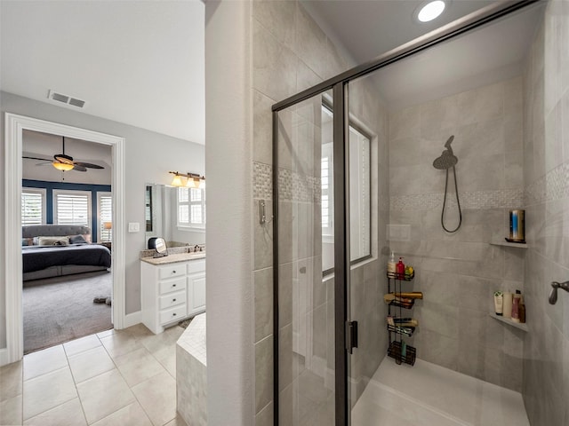 604 Rough Creek Dr, Mckinney, TX 75071 - full bath with vanity, connected bathroom, a stall shower, tile patterned flooring, and ceiling fan