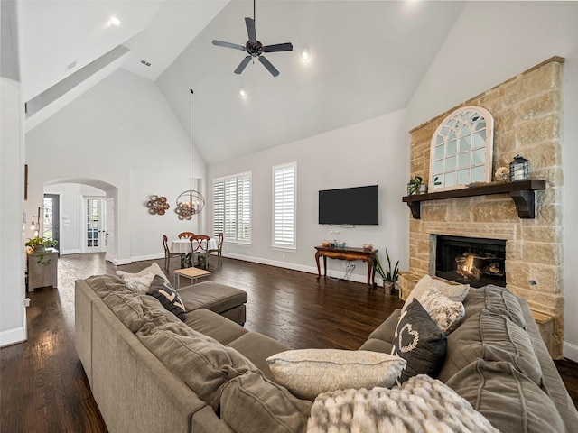 604 Rough Creek Dr, Mckinney, TX 75071 - living room featuring high vaulted ceiling, ceiling fan, healthy amount of natural light, arched walkways, and dark wood-style flooring